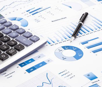 Calculator and pen with blue business charts, graphs, infomation and reports background for financial and business concepts